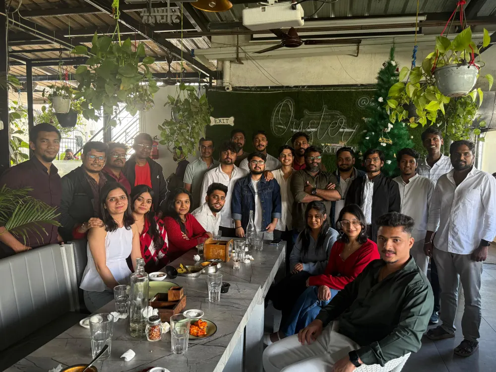 The whole Zethic team gathered around a long table at a team lunch