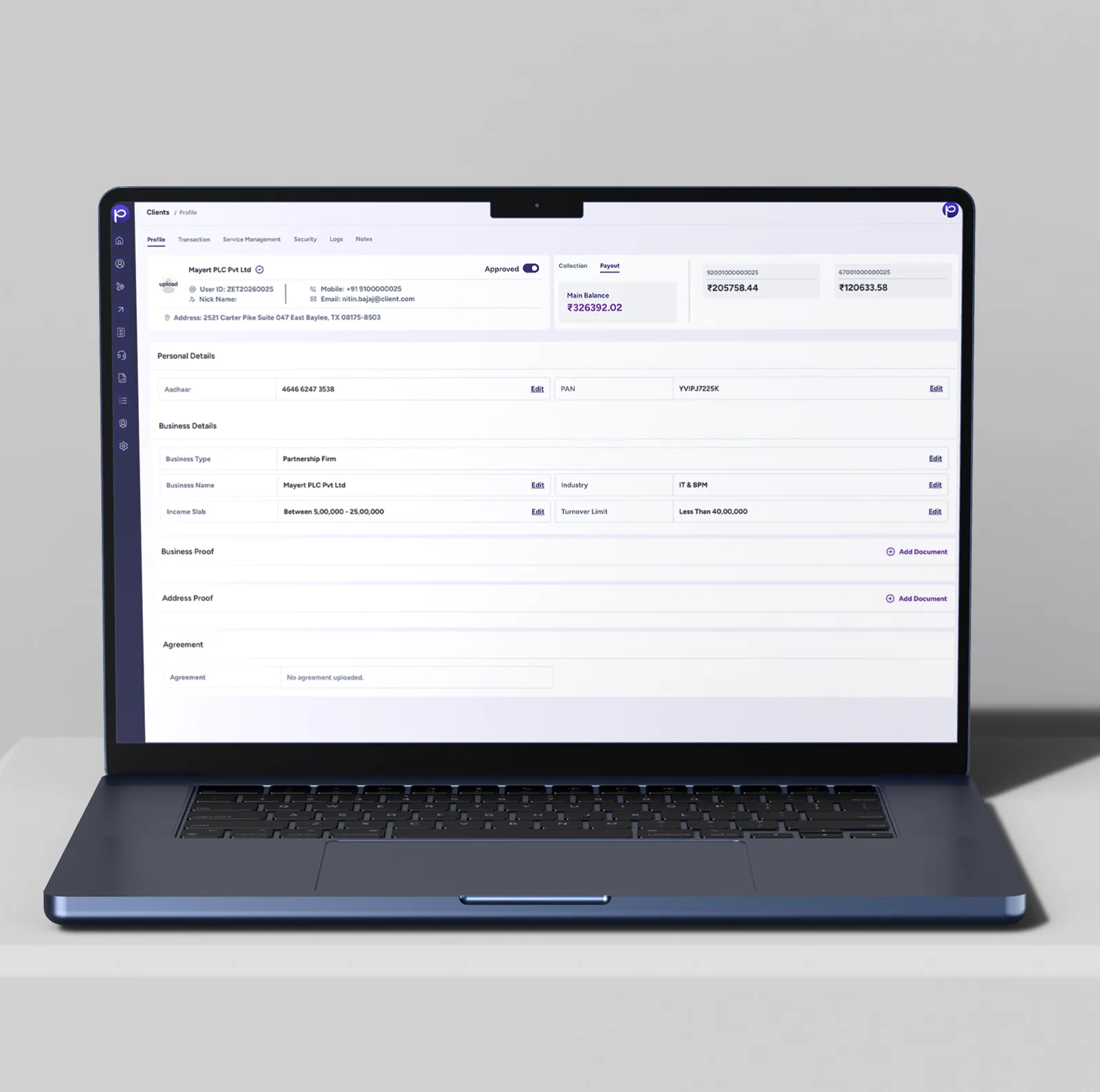 Laptop showing a client profile on the Payout tab with the main balance